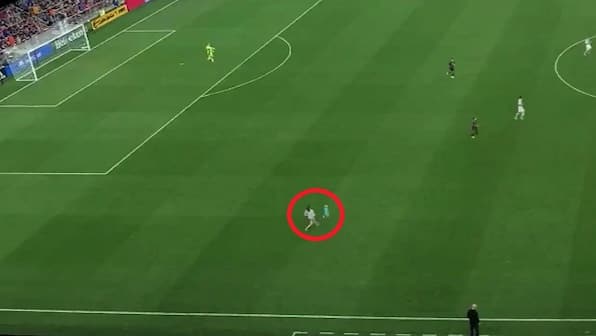 Watch: Two-year-old kid runs onto soccer pitch during match, mom tackles him in seconds