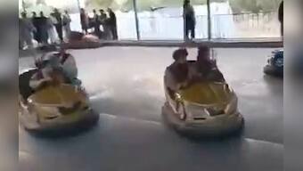 When the Taliban come to town: Kalashnikovs in hand, fighters check out presidential gym, enjoy rides at Kabul amusement park