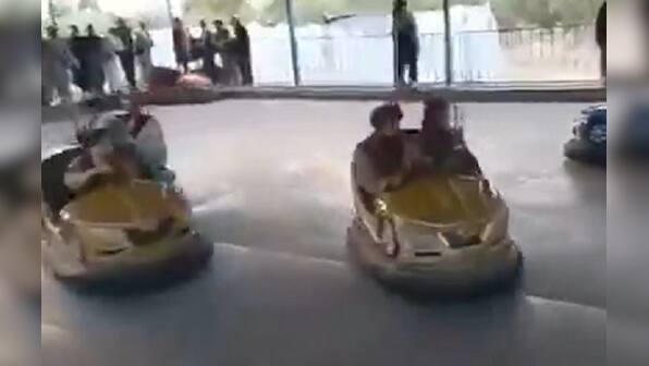 When the Taliban come to town: Kalashnikovs in hand, fighters check out presidential gym, enjoy rides at Kabul amusement park