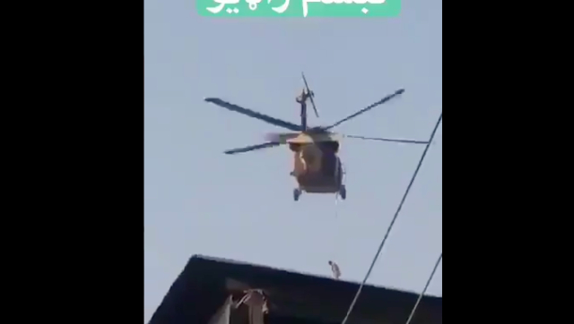 After US exit, Taliban fly American chopper with body hanging from rope; see video here After US exit, Taliban fly American chopper with body hanging from rope; see video here