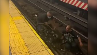 Not all heroes wear capes: Man rescues wheelchair-bound commuter who fell on tracks, minutes before train arrives