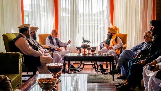 In this handout photograph released by the Taliban, former Afghan President Hamid Karzai, center left, senior Haqqani group leader Anas Haqqani, center right, Abdullah Abdullah, second right, head of Afghanistan's National Reconciliation Council and former government negotiator with the Taliban, and others in the Taliban delegation, meet in Kabul, Afghanistan. AP