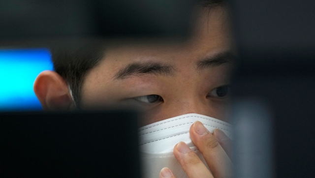 Asian markets, Wall Street hold gains after Fed signals easing extraordinary support measures for economy Asian markets, Wall Street hold gains after Fed signals easing extraordinary support measures for economy