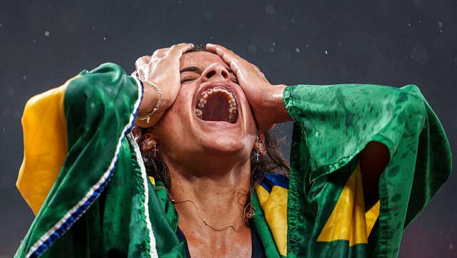 Brazil’s Jardenia Felix Barbosa Da Silva celebrates after finishing third in the Athletics Women’s 400m - T20 Final during the Tokyo 2020 Paralympic Games, in Tokyo, Tuesday, Aug. 31, 2021. (Thomas Lovelock for OIS via AP)
