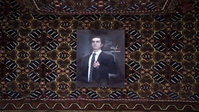 A portrait of Zaki Anwari, a 17-year-old soccer player who died after falling from a departing US Air Force C-17 on 16 August. AP