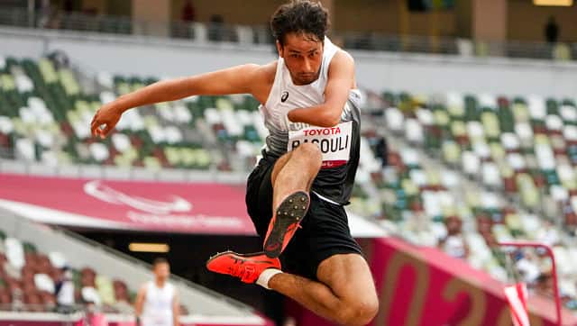 Afghanistan’s Hossain Rasouli competes in the men’s T47 long jump during the 2020 Paralympics at the National Stadium in Tokyo, Tuesday, Aug. 31, 2021. (AP Photo/Eugene Hoshiko)
