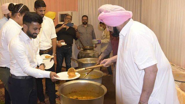 Indian men's hockey team captain Manpreet Singh is served by Punjab Chief Minister Captain Amarinder Singh.