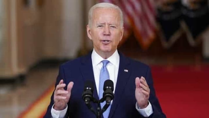 By the numbers: Stats that tell story of President Joe Biden's first year