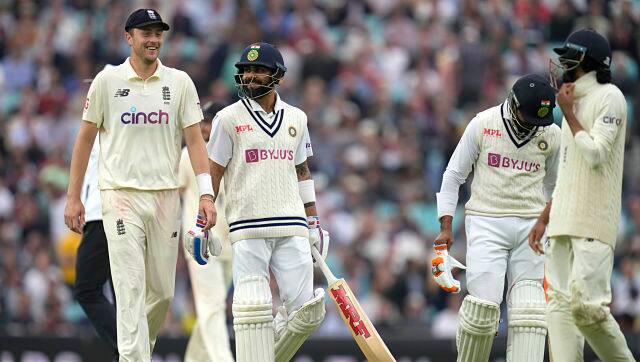 India skipper Virat Kohli and England’s Ollie Robinson share a smile as the players walk off the field owing to bad light. India were 270/3, with a lead of 171 runs at stumps on the third day. Virat Kohli and Ravindra Jadeja will resume the innings on Sunday. AP 