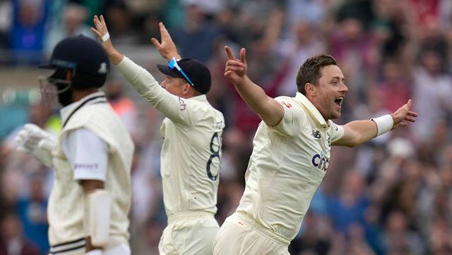 Ollie Robinson picked two wickets, that of Rohit Sharma and Cheteshwar Pujara. AP 