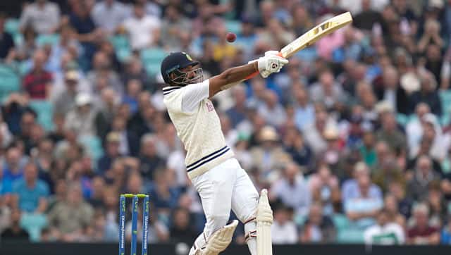 Cheteshwar Pujara played a knock of 61, forging a 153-run partnership with Rohit Sharma for the second wicket. AP 