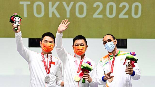 India’s Singhraj Adhana (right) celebrates his 10m air pistol bronze medal on the podium on Tuesday. Image courtesy: Twitter/@ShootingPara