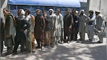 Cash-starved Afghans form long queues as bank operations resume
