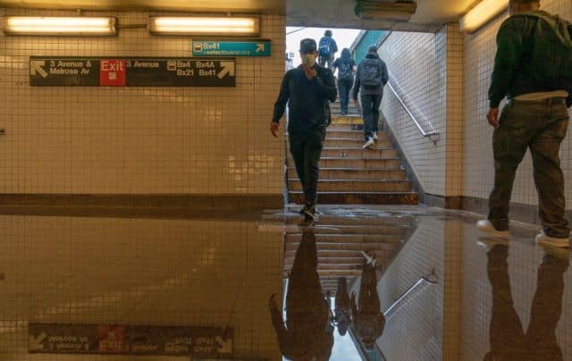 Water from the record rainfall cascaded into New York City subway tunnels, trapping at least 17 trains and forcing the cancellation of service throughout Wednesday night and Thursday morning. AFP
