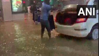 Heavy rain floods Bengaluru airport; flyers take tractor rides to catch their flights