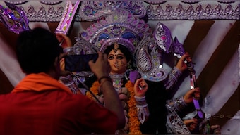 Watch: Revellers in Kolkata try innovative way to beat rain during Durga Puja