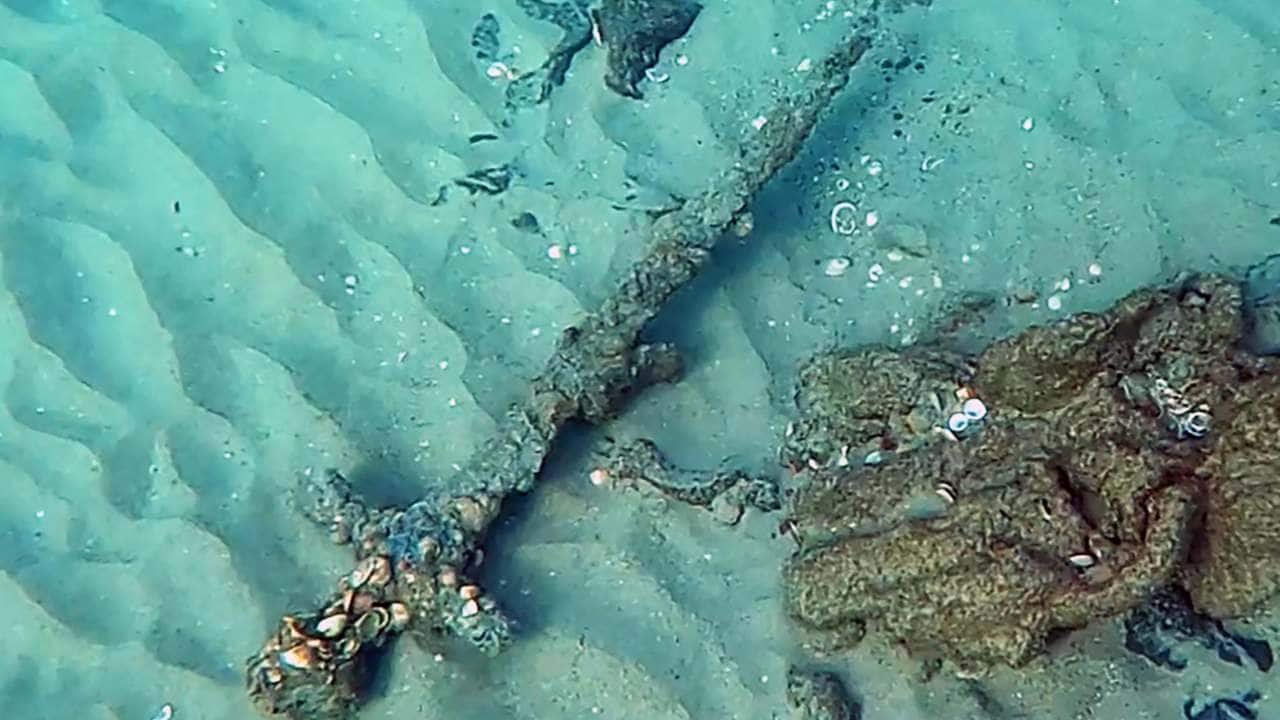 An image from video provided by Shlomi Katzin shows a four-foot-long sword dating back to the Third Crusade that he found on the floor of the Mediterranean Sea off the coast of Israel. The 900-year-old sword most likely belonged to a knight who fell into the sea or lost the weapon in battle, experts say. Image credit: Shlomi Katzin via The New York Times