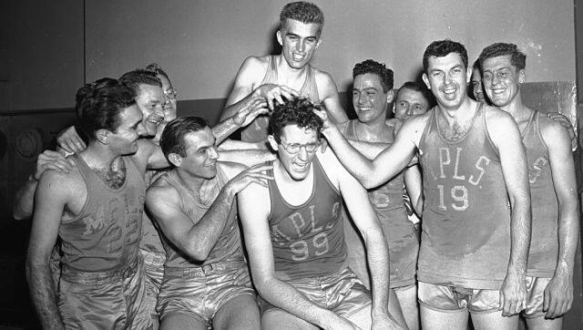 File photo from February 22, 1949, shows Minneapolis Lakers George Mikan (jersey no 99) getting his hair messed up by teammates in New York’s Madison Square Garden after he set a Basketball Association of America scoring record for the Garden with 48 points. AP Photo