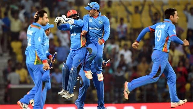Afghanistan’s players celebrate after winning the World T20 match against West Indies at The Vidarbha Cricket Association Stadium in Nagpur on March 27, 2016. AFP
