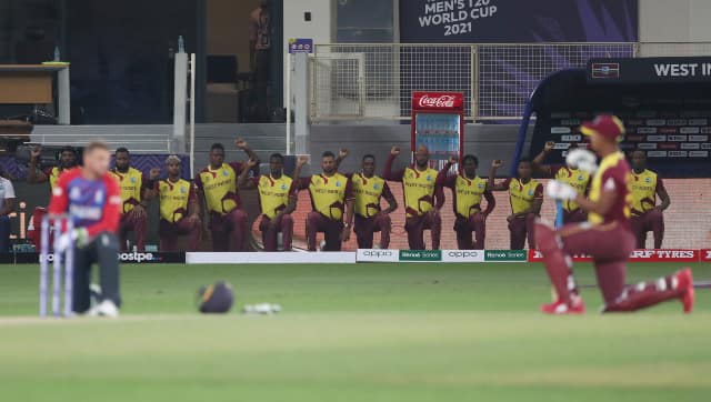 England and West Indies players take a knee in solidarity against racism before start of play. AP