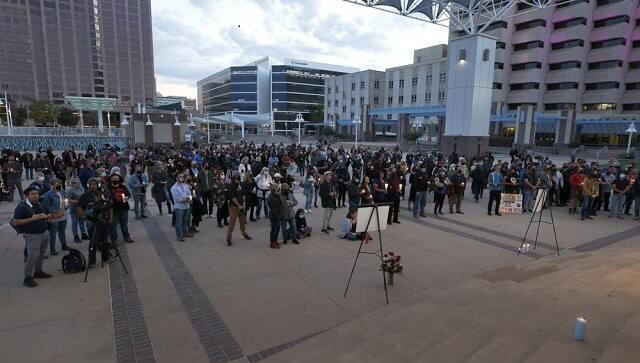 A large crowd of movie industry workers and New Mexico residents attend a candlelight vigil to honor cinematographer Halyna Hutchins in downtown Albuquerque, N.M. Saturday, Oct. 23, 2021. Hutchins was killed when Alec Baldwin fired a weapon on a film set that a crew member told him was safe. The tragedy has led to calls for fundamental change in Hollywood: the banning of real guns on sets. (AP Photo/Andres Leighton, file)