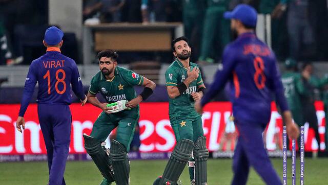 India skipper Virat Kohli congratulates Babar Azam and Mohammad Rizwan following the match. AP 