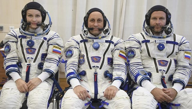 In this handout photo released by Roscosmos, Actress Yulia Peresild, left, director Klim Shipenko’ right, and cosmonaut Anton Shkaplerov, members of the prime crew of Soyuz MS-19 spaceship pose at the Russian launch facility in the Baikonur Cosmodrome, Kazakhstan, Sunday, 19 September, 2021 | (Roscosmos Space Agency via AP)