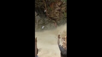 Tamil Nadu forest officials rescue mother, child from raging waterfall; watch viral video here