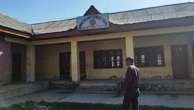 Zahoor Ahmad Magray, a watchman standing in a playground of school at Sangam, Idgah. Image credit: Quratulain Rehbar 