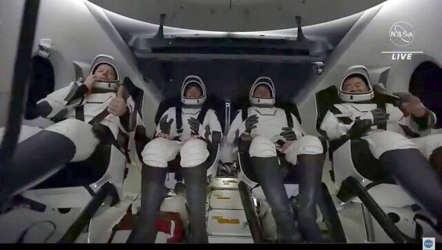 In this image taken from NASA video, the crew of the SpaceX Dragon capsule react after splashing down into the Gulf of Mexico near Pensacola, Fla., late on Monday to end a 200-day space station mission that began last spring. AP