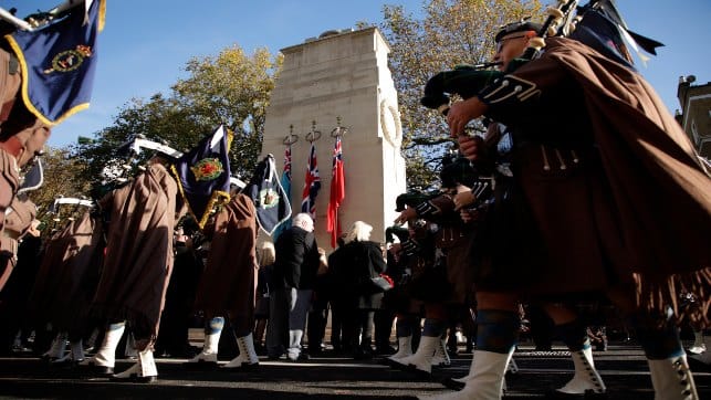 A military band marches by as people attend a Service of Remembrance at the Cenotaph on Whitehall in London on Thursday. AP