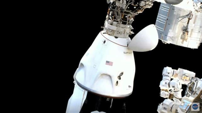 Astronauts in the SpaceX Dragon capsule prepare for undocking from the International Space Station. AP