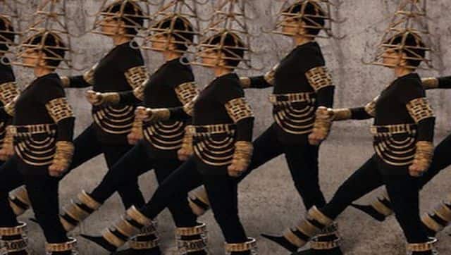 An army of female warriors walk in a synchronous manner as part of Shakuntala Kulkarni's 'Juloos' work. They are partly adorned in cane accessories, which Kulkarni designed. Photo Courtesy: Shakuntala Kulkarni