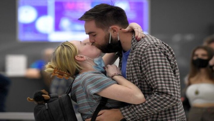 Airports are scenes of joyous hugs, teary reunions as US reopens its borders after 20 months