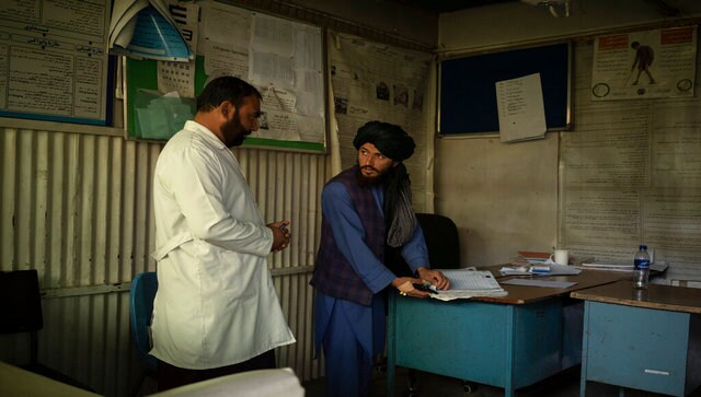 At hospital in Afghanistan's Kabul, unpaid and exhausted doctors clash with rigid Taliban-appointed supervisor