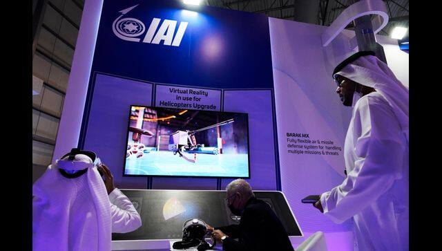 An Emirati examines a virtual reality display at the Israel Aerospace Industries stand at the Dubai Air Show AP Photo