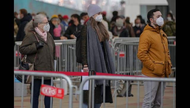 People wait to get COVID-19 vaccines in Vienna. AP