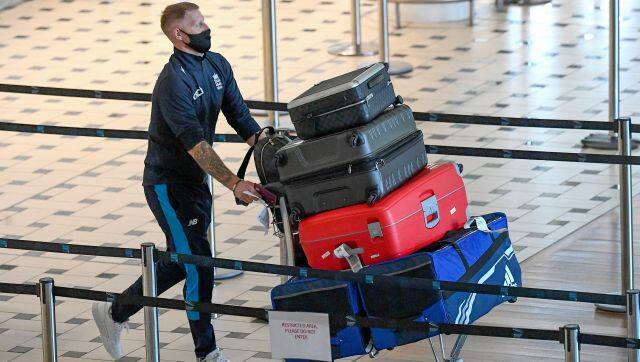 England cricketer Ben Stokes walks through the terminal at Brisbane Airport in Australia, Saturday, Nov. 6, 2021. The England cricket team have arrived in Australia ahead of a five test Ashes series beginning on Dec. 8 in Brisbane. (Dave Hunt/AAP Image via AP)