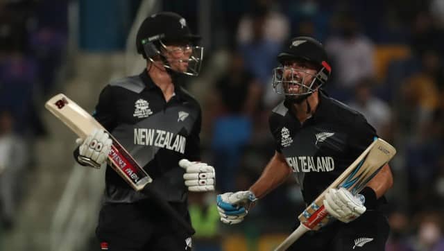 New Zealand's Daryl Mitchell, right, and Mitchell Santner celebrate winning the T20 World Cup semi-final match against England. AP Photo