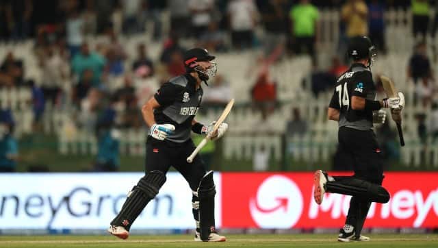 Daryl Mitchell (L) celebrates after New Zealand’s five-wicket win in the semi-finals. AP Photo
