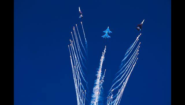 The Russian Knights perform a stunt after releasing chaff at the Dubai Air Show in Dubai. AP photo