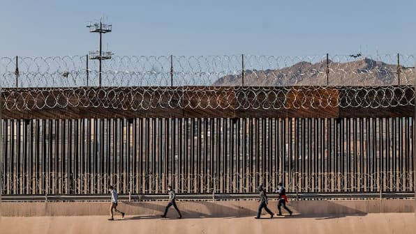 As economies struggle with COVID-19 pandemic, wealthy nations wage global battle for migrants