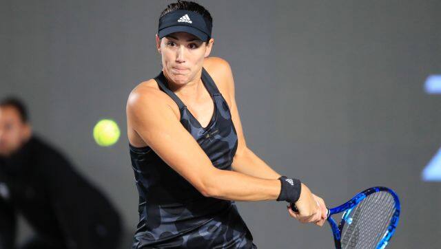 Garbine Muguruza of Spain, returns a shot to Karolina Pliskova of the Czech Republic, during a match of the Mexican Tennis WTA Finals in Guadalajara, Mexico, Wednesday, Nov. 10, 2021. (AP Photo/Refugio Ruiz)