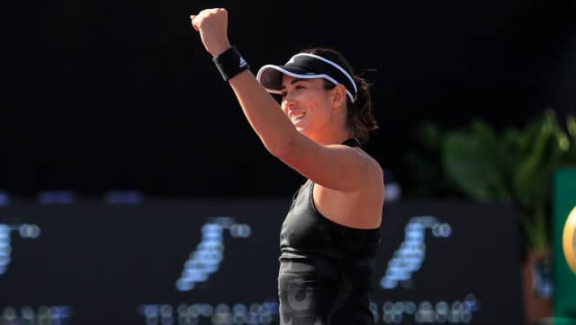 Garbiñe Muguruza celebrates after defeating Paula Bados during a semi-final match at WTA Finals. AP
