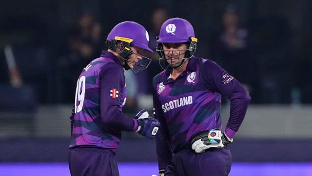 Michael Leask (Left) and Calum MacLeod during the game. Leask top-scored for Scotland with 21 runs. AP 