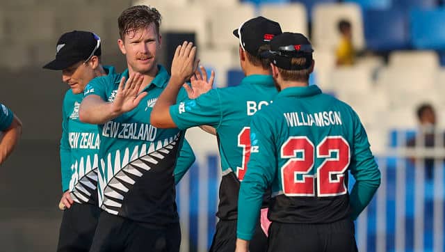 New Zealand's Jimmy Neesham, second left, is congratulated by teammates after he took the wicket Namibia's Michael Van Lingen. AP