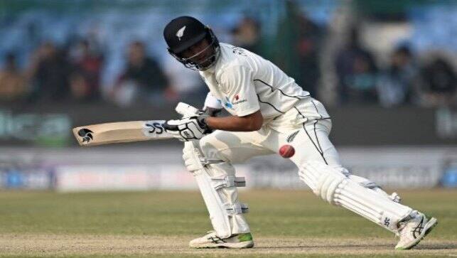 New Zealand’s Rachin Ravindra watches the ball after playing a shot on the third day of the first Test cricket match between India and New Zealand at the Green Park Stadium in Kanpur on 27 November, 2021. AFP