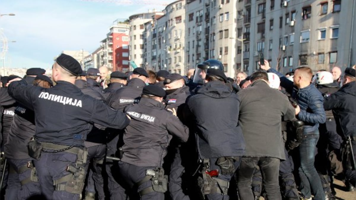 Anti-government protesters block bridges, roads in Serbia against new laws 'favouring foreign investors'