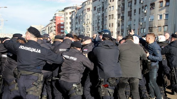 Anti-government protesters block bridges, roads in Serbia against new laws 'favouring foreign investors'
