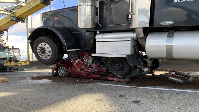 US woman survives after car crushed by an 18-wheeler truck; walks out with minor injuries US woman survives after car crushed by an 18-wheeler truck; walks out with minor injuries